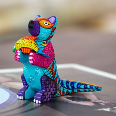 Alternate image for Handcrafted Turquoise Copal Wood Otter and Fish Figurine Turquoise River Days