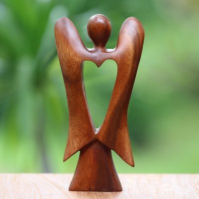 Alternate image for Hand Carved Wood Figurine of an Angel with Heart Feature Heart of an Angel