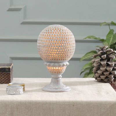 Alternate image for Globe-Shaped Openwork Hand-Carved Soapstone Tealight Holder Reflection from the Past